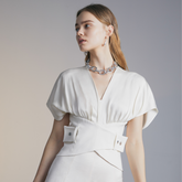 The front of a model wearing a white Belted Top