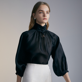 Close-up of the front of a model wearing a black Organza Shirt