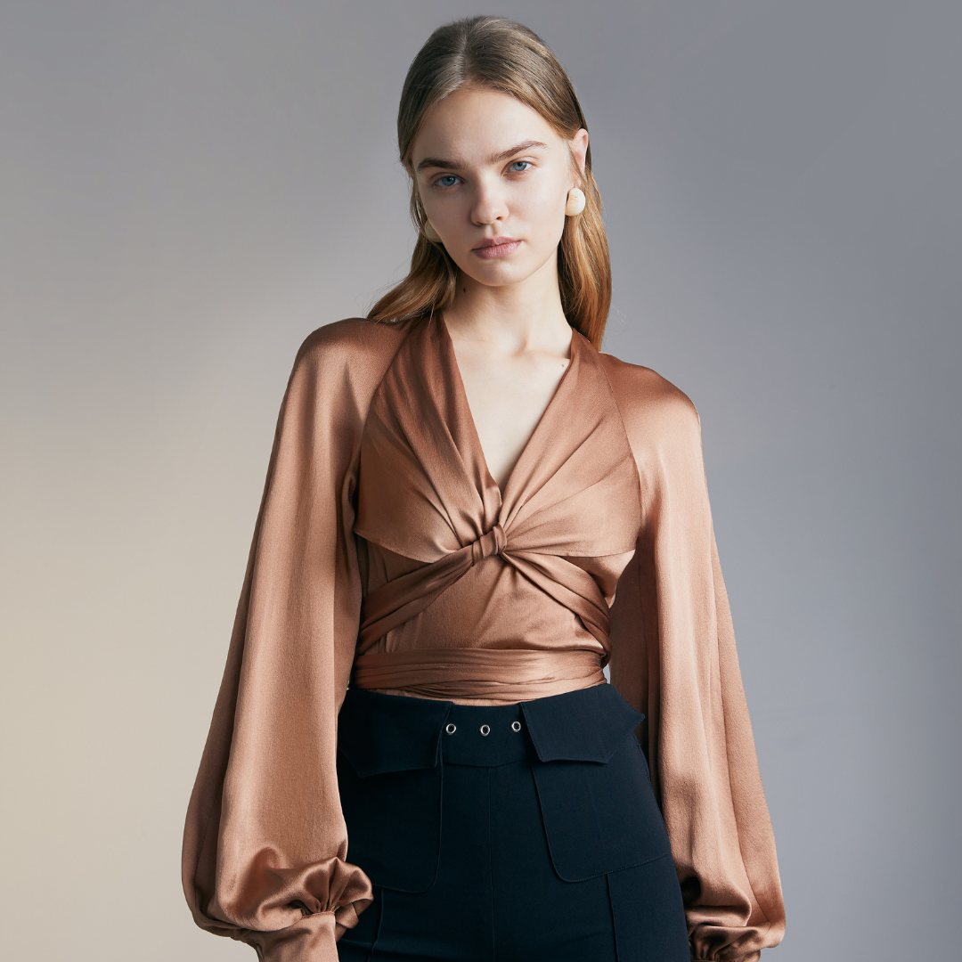 Close-up of the front of a model wearing a brown colored Knotted Silk Shirt