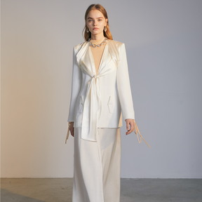 The front of a model wearing a white Knotted Suit Jacket