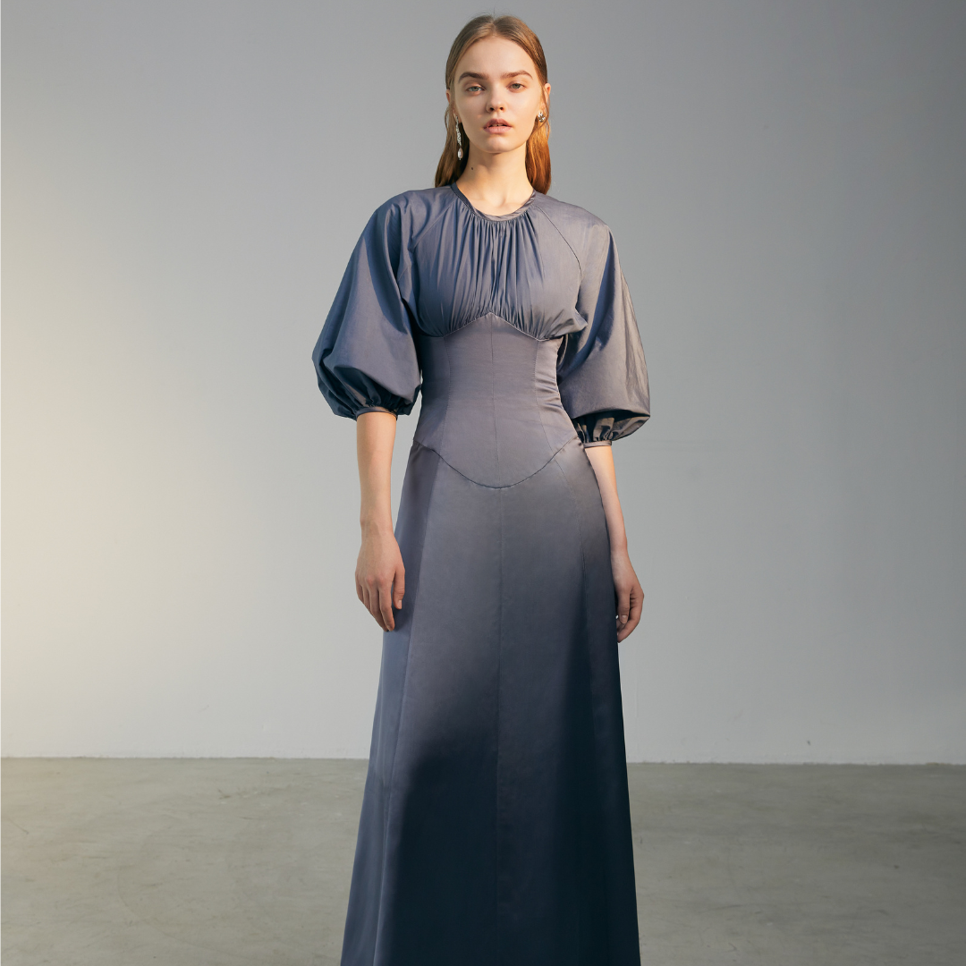 The front of a model wearing a blue Gigot Sleeve Dress