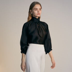 The front of a model wearing a black Organza Shirt