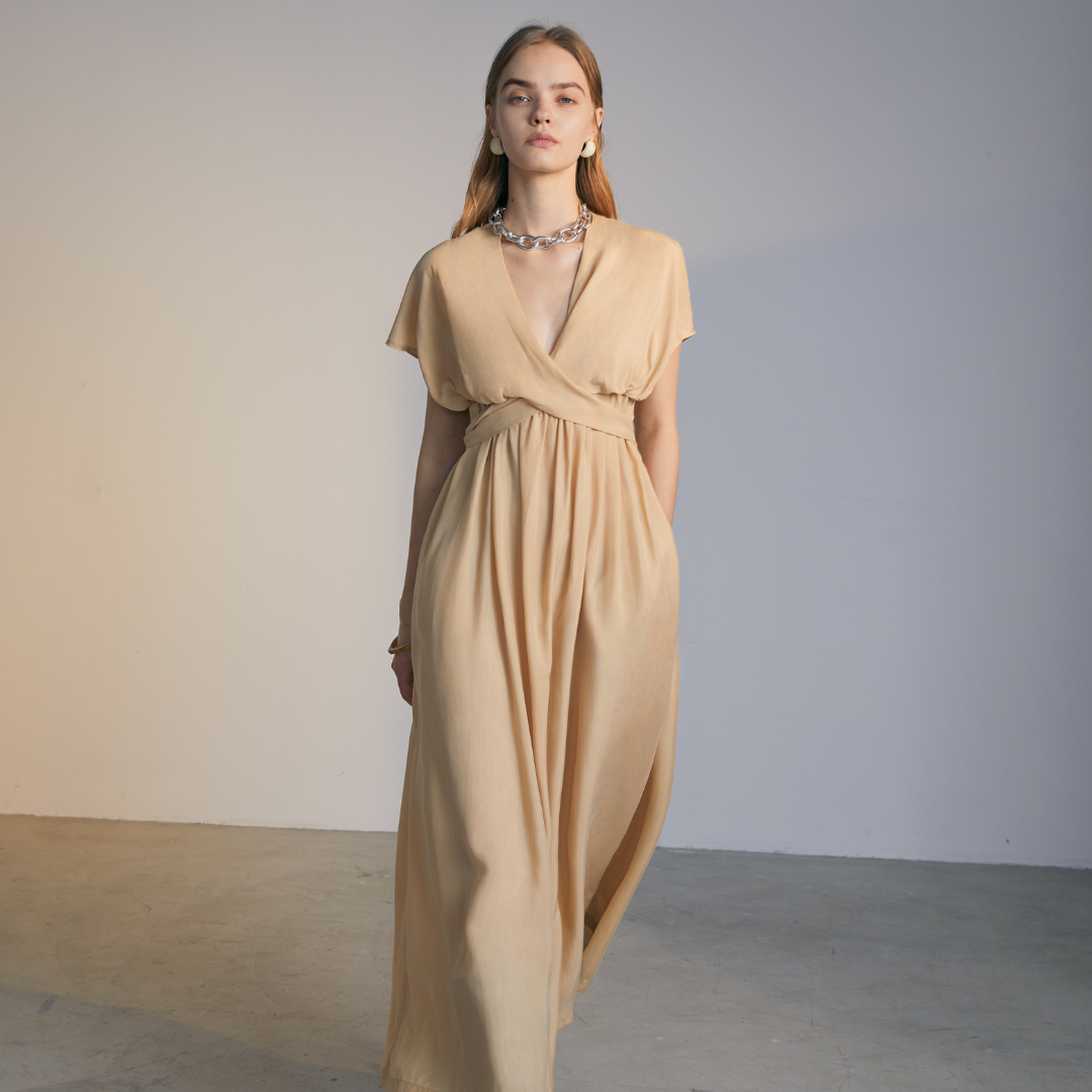 The front of a model wearing a natural colored Knotted Dress