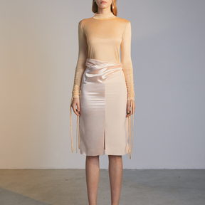 The front of a model wearing an ivory colored Twisted Skirt