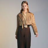 The front of a model wearing a light brown Short Trench Coat