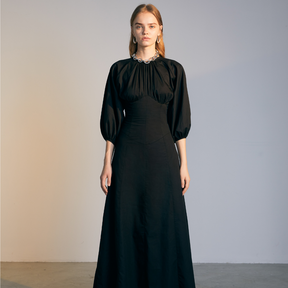 The front of a model wearing a black Gigot Sleeve Dress