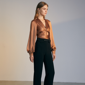 The side of a model wearing a brown colored Knotted Silk Shirt