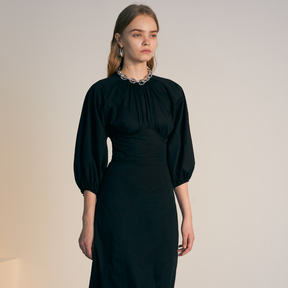 The front of a model wearing a black Gigot Sleeve Dress