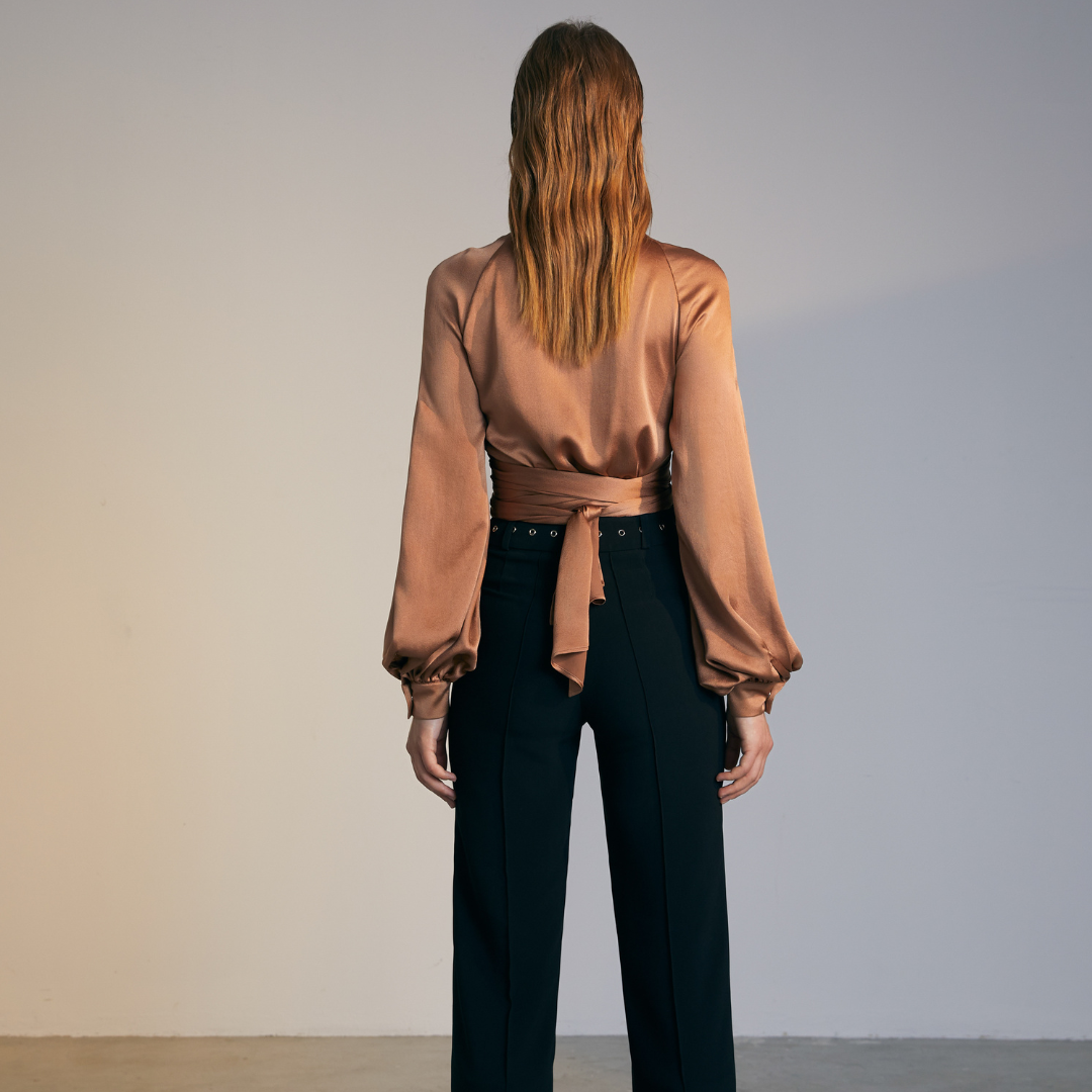 The back of a model wearing a brown colored Knotted Silk Shirt