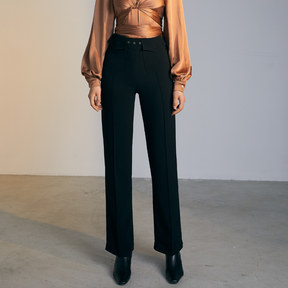 The front of a model wearing black high-waisted fitted pants