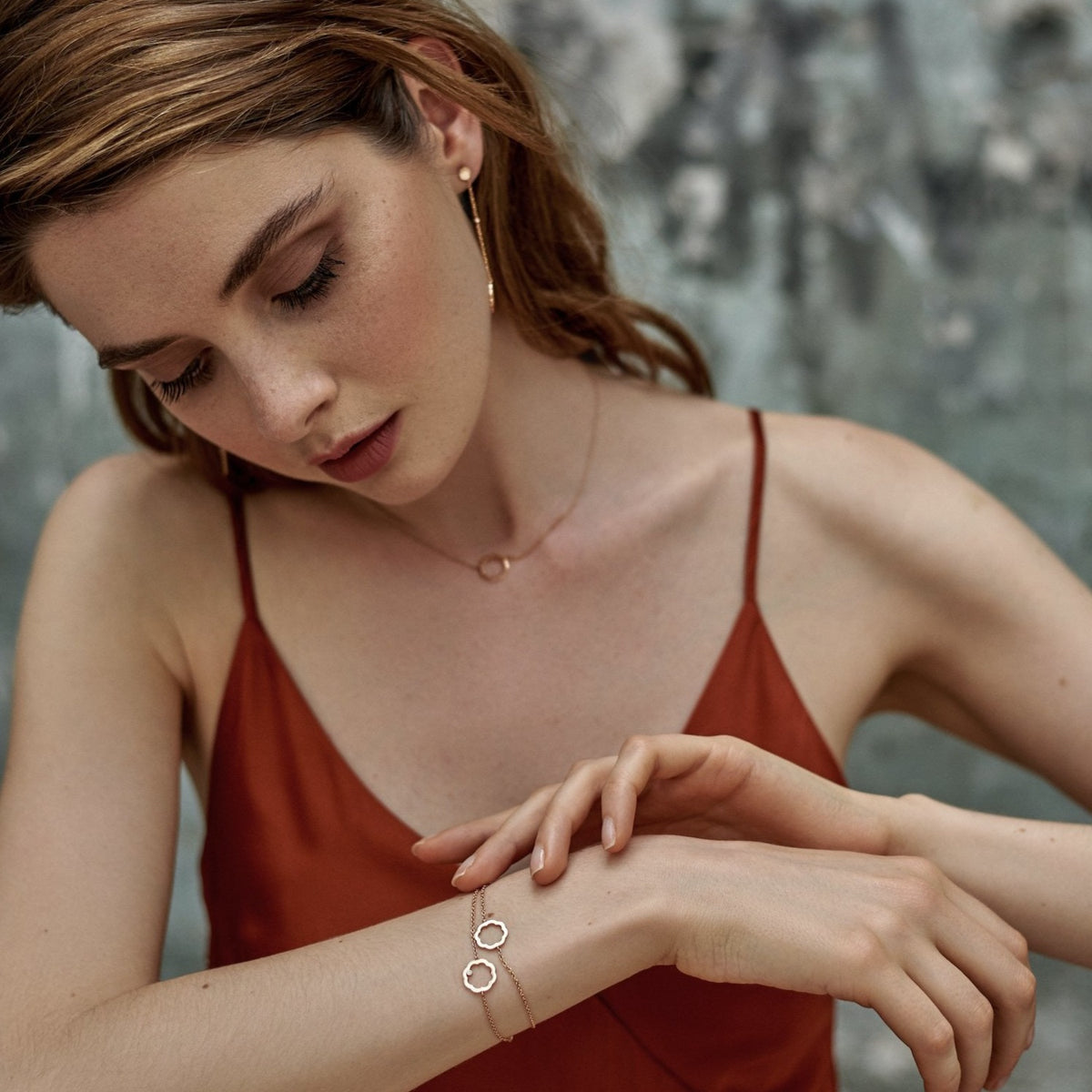 A model wearing Classic MIMOSA Rose gold bracelets, one with a diamond and one without