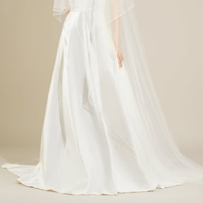The front of a model wearing a white MARGUERITE Wedding Dress