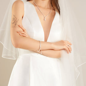 Close-up of the front of a model wearing a white MARGUERITE Wedding Dress